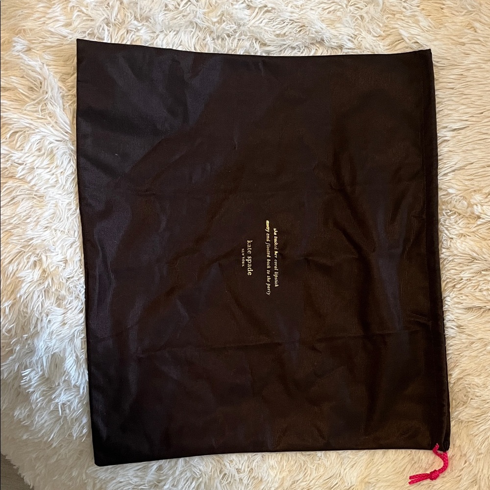 Kate spadeDark brown and gold draw string bag.